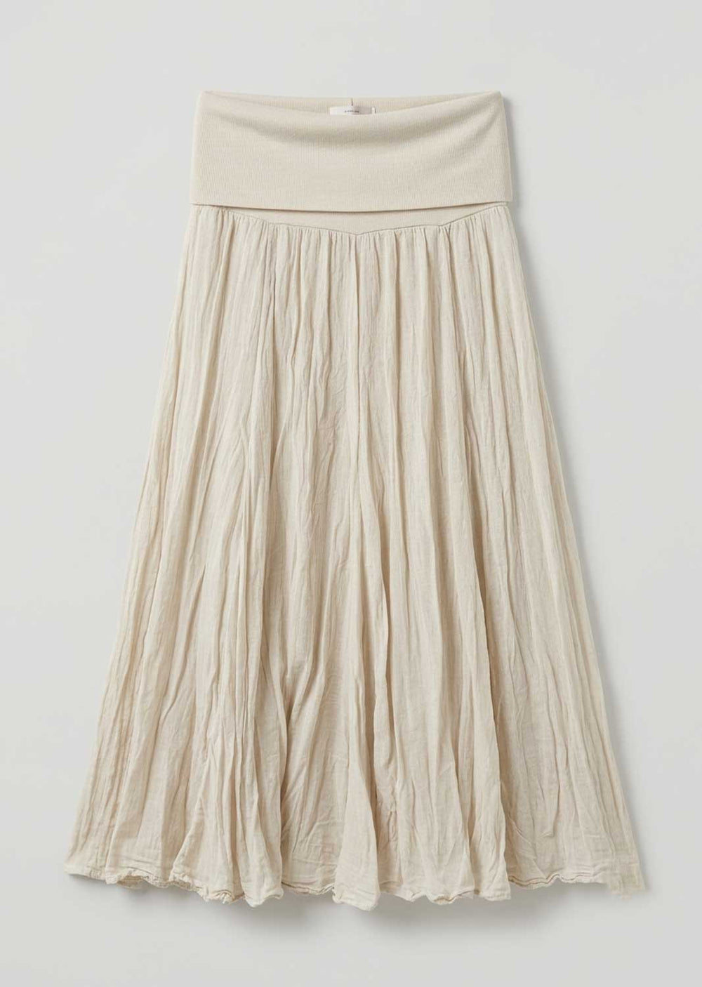 A cream-colored pleated midi skirt with a wide elastic waistband, shown against a plain light gray background.