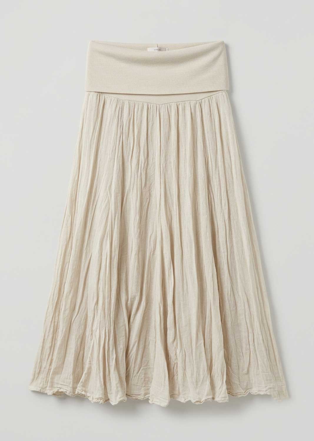 A cream-colored pleated midi skirt with a wide elastic waistband, shown against a plain light gray background.