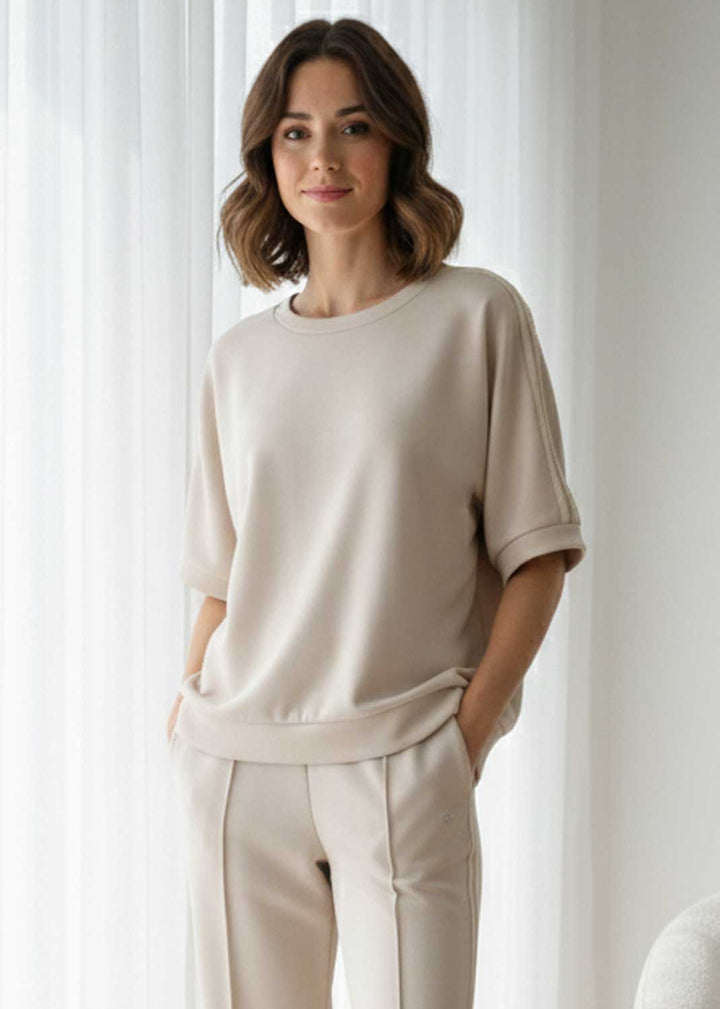 cream short sleeved  sweater top 