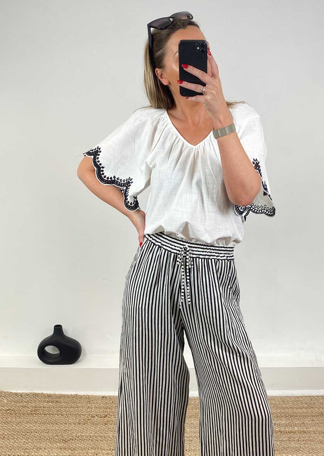 in the sale, white loose top