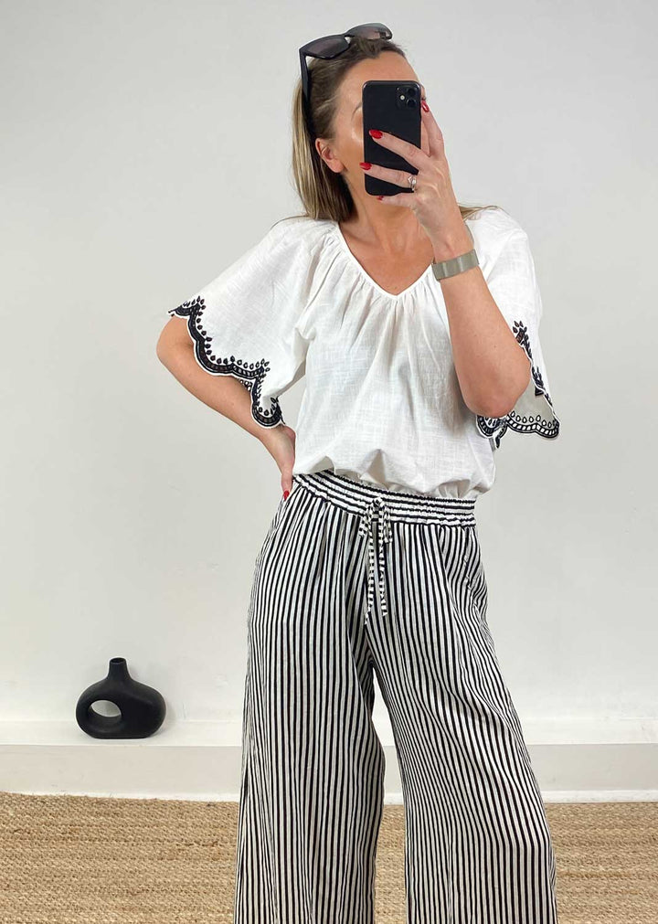 in the sale, white loose top